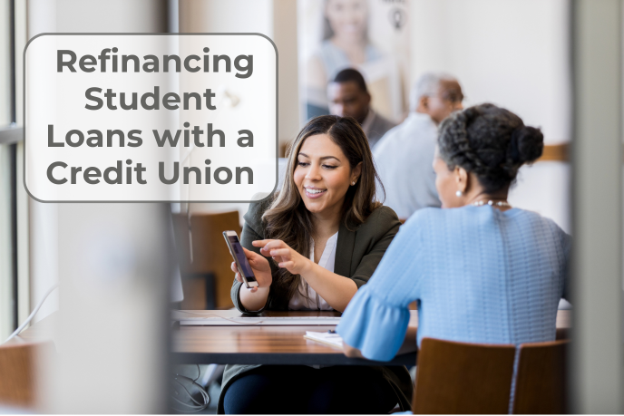 Credit union student loan refinance comparison A businesswoman holds a cell phone, showing a young woman across her desk the screen.