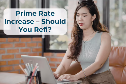 A woman sits typing at a laptop. The words "Prime Rate Increase - Should You Refi?" are overlaid at the top left.
